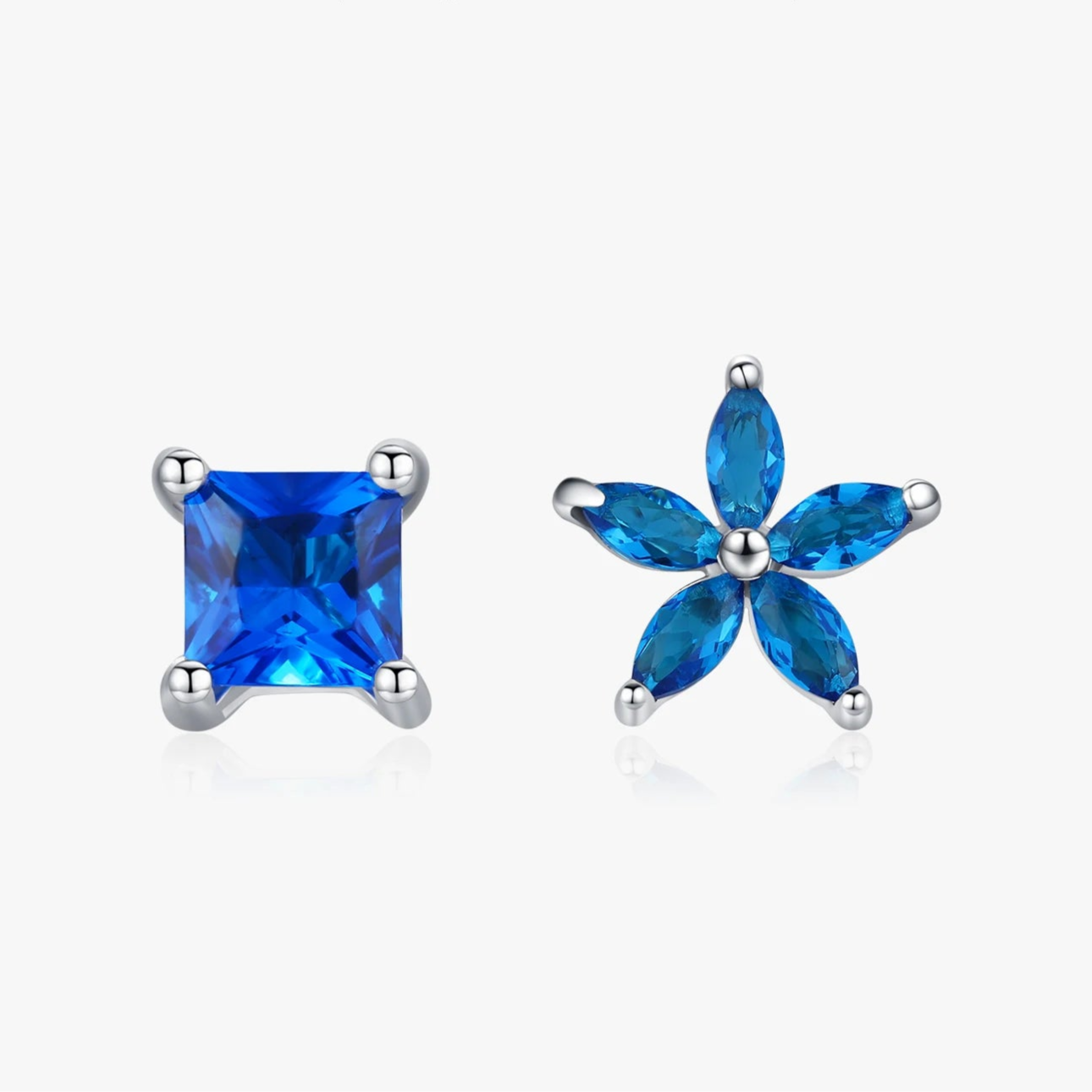 Blue zirconia earrings with asymmetry and flowers in 925 sterling silver